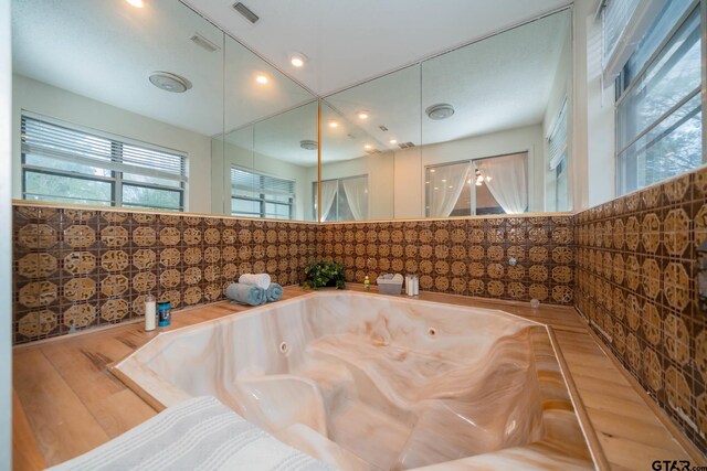 bathroom featuring hardwood / wood-style flooring and a bathtub