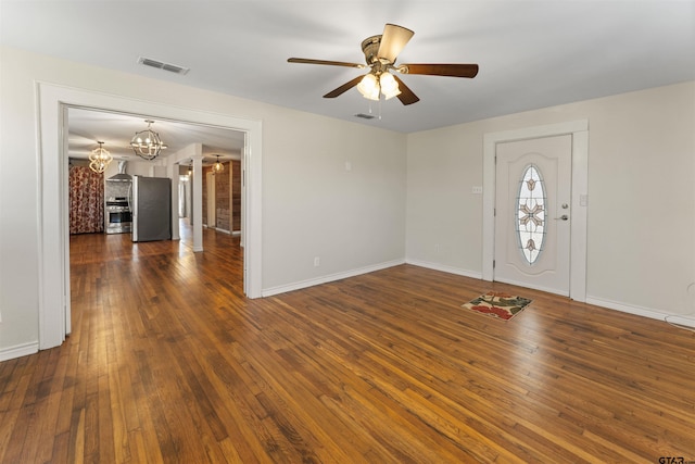 entryway with dark wood-style floors, baseboards, visible vents, and ceiling fan with notable chandelier