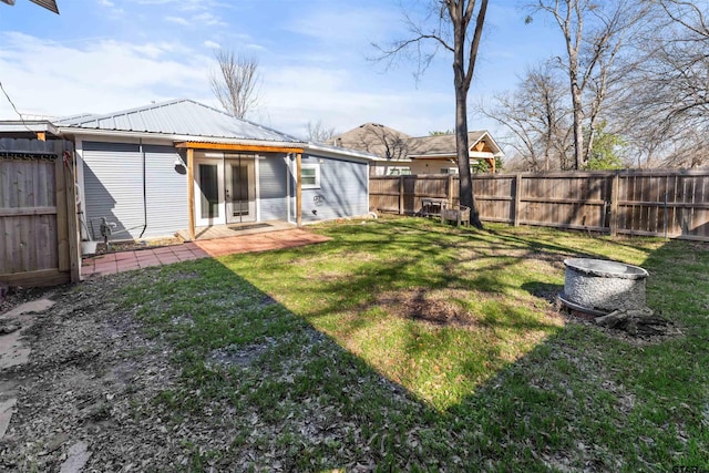 view of yard featuring a patio area and a fenced backyard