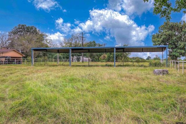 view of yard with a rural view