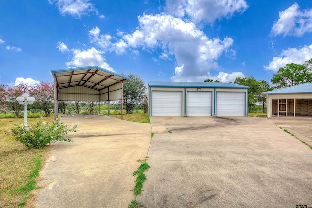 garage featuring a carport