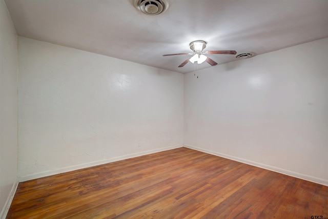 unfurnished room featuring hardwood / wood-style flooring and ceiling fan