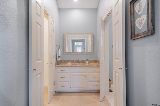 207 S King Laurence Ct, Scroggins, TX 75480 - bathroom with vanity and a textured wall