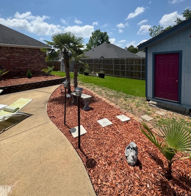 view of yard with a fenced backyard