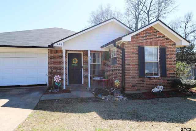 ranch-style home featuring driveway, brick siding, and an attached garage