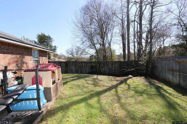 view of yard with a fenced backyard