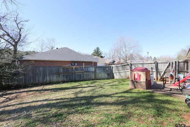 view of yard with a fenced backyard