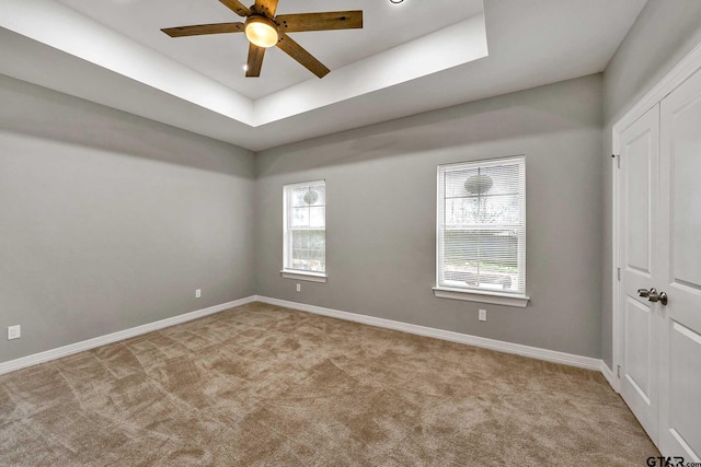 1608 N Englewood Ave, Tyler, TX 75702 - carpeted spare room featuring a ceiling fan and a tray ceiling