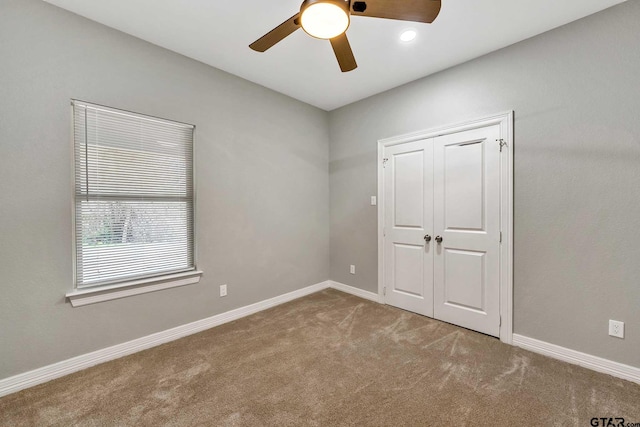 1608 N Englewood Ave, Tyler, TX 75702 - unfurnished bedroom with carpet, baseboards, a closet, and ceiling fan