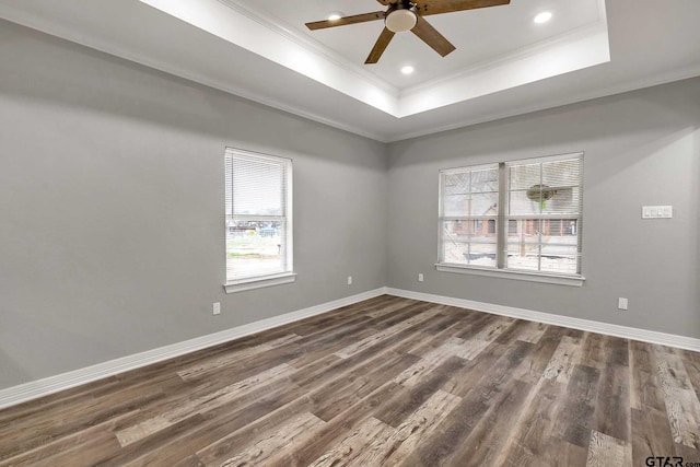 1608 N Englewood Ave, Tyler, TX 75702 - unfurnished room featuring crown molding, a raised ceiling, a ceiling fan, dark wood-type flooring, and baseboards