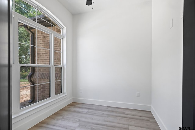 spare room with ceiling fan and light hardwood / wood-style floors