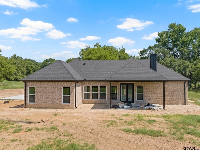 rear view of house with a patio