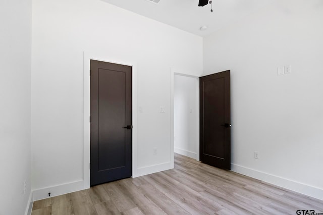 unfurnished bedroom featuring ceiling fan and light hardwood / wood-style flooring