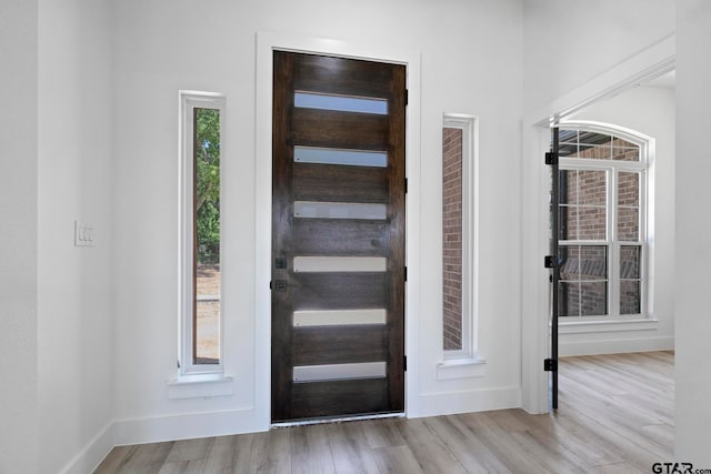 entryway with light hardwood / wood-style flooring