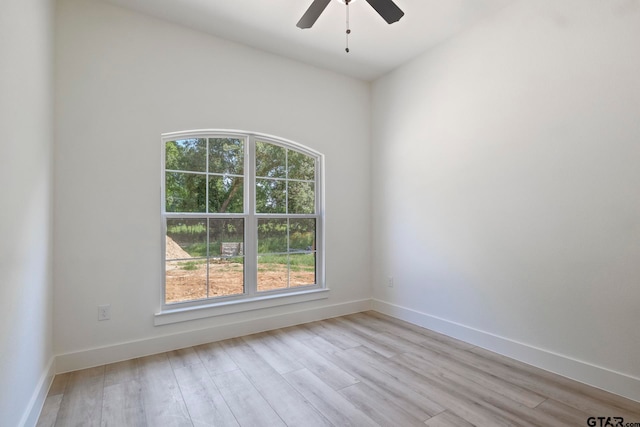 spare room with light hardwood / wood-style flooring and ceiling fan