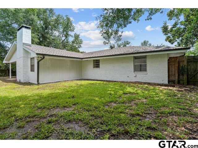 1812 Montrose Dr, Tyler, TX 75701 - back of house featuring a chimney and brick siding