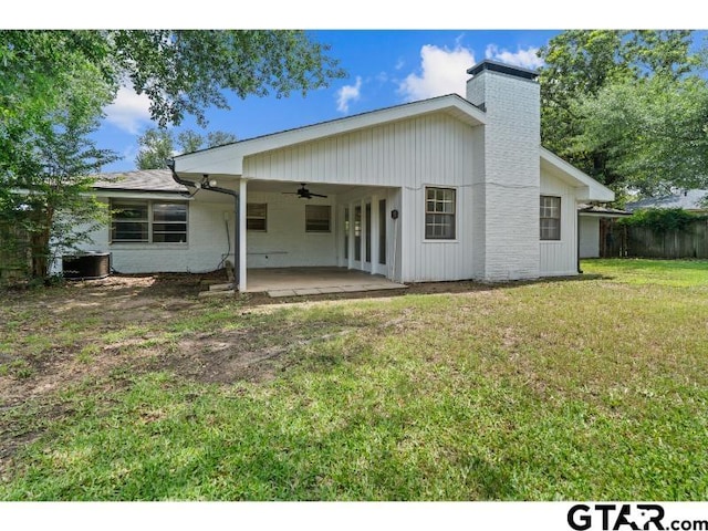 1812 Montrose Dr, Tyler, TX 75701 - back of house with ceiling fan, a patio area, a chimney, an attached carport, and central AC unit
