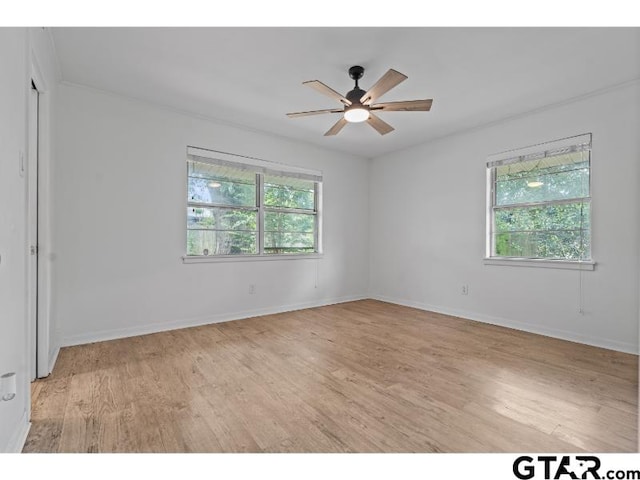 1812 Montrose Dr, Tyler, TX 75701 - spare room featuring light wood-style flooring, a ceiling fan, and baseboards