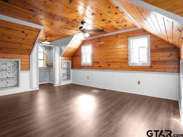 additional living space with dark hardwood / wood-style flooring, vaulted ceiling, ceiling fan, and wood ceiling