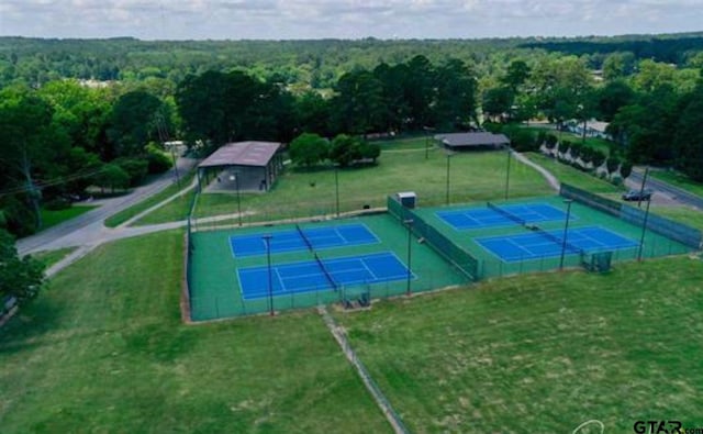 89 S Ryder Cup, Hideaway, TX 75771 - view of tennis court featuring a view of trees