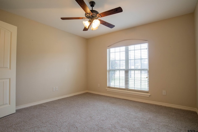 carpeted empty room with ceiling fan