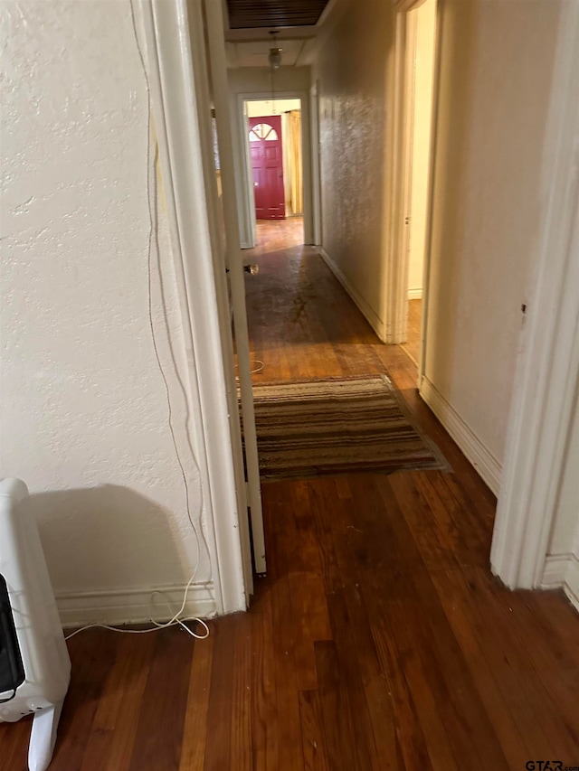 hallway featuring dark wood-type flooring