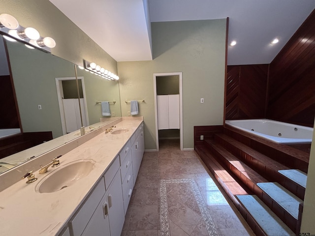 20868 Bay Shore Dr, Flint, TX 75762 - bathroom featuring double vanity, a whirlpool tub, and recessed lighting