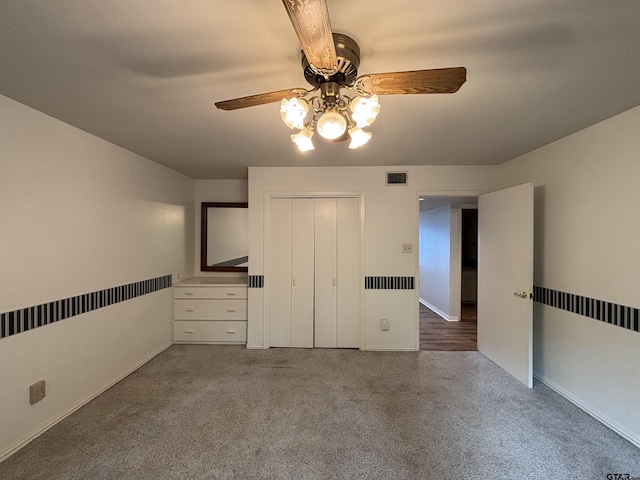 20868 Bay Shore Dr, Flint, TX 75762 - unfurnished bedroom featuring carpet, a ceiling fan, and a closet