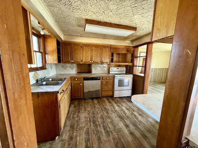 kitchen with dishwasher, dark hardwood / wood-style flooring, sink, white electric stove, and tile counters