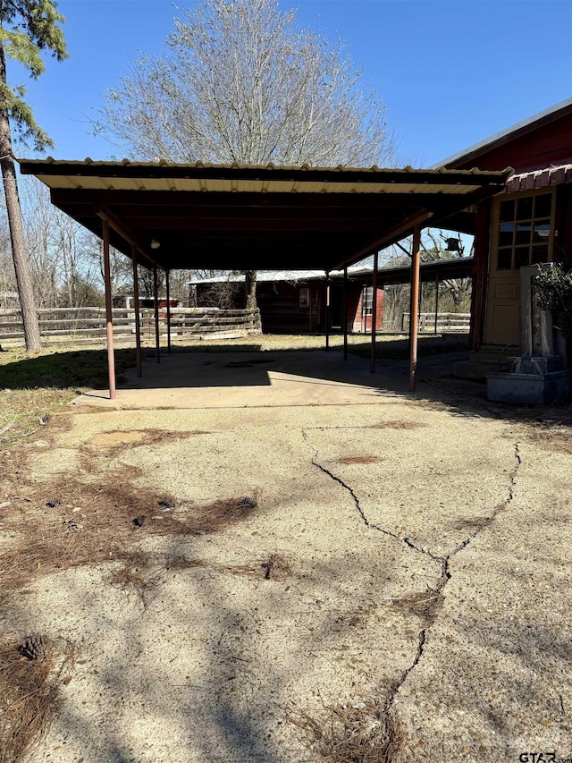 view of vehicle parking featuring a carport