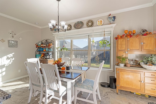 dining space with a notable chandelier and crown molding