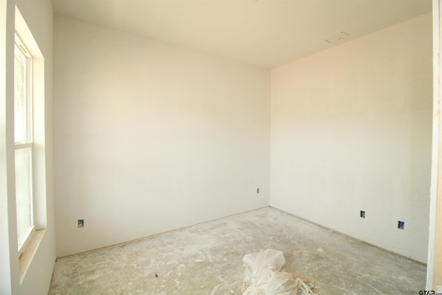 empty room featuring unfinished concrete floors