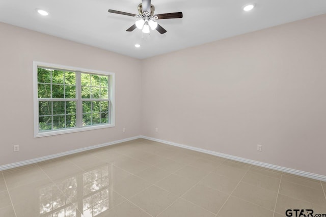 empty room with recessed lighting, baseboards, and light tile patterned floors