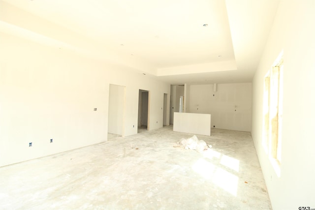 empty room featuring a tray ceiling