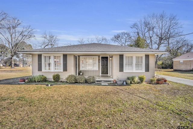 ranch-style house with a front lawn