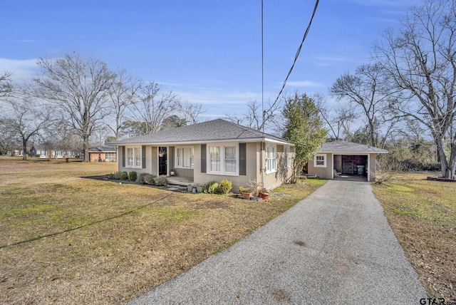 view of front of property with a carport and a front yard