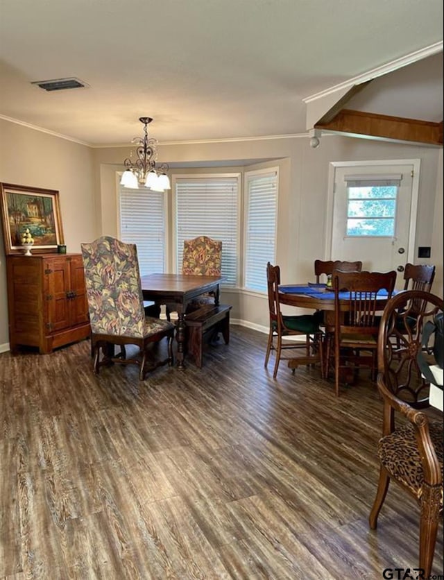 114 Mockingbird, Mount Pleasant, TX 75455 - dining space featuring crown molding, wood finished floors, a chandelier, and baseboards