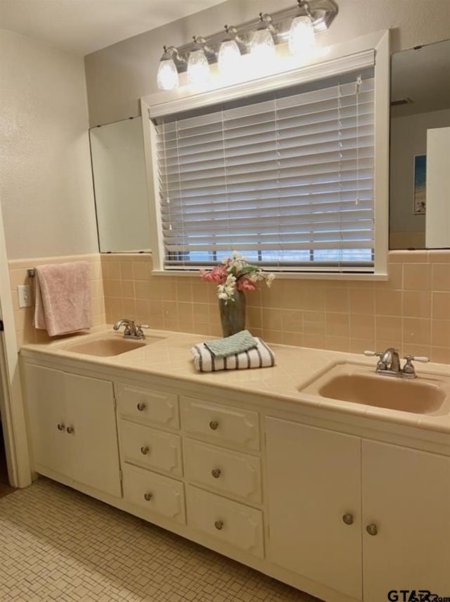 114 Mockingbird, Mount Pleasant, TX 75455 - full bathroom featuring double vanity and decorative backsplash