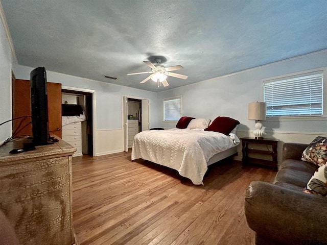 114 Mockingbird, Mount Pleasant, TX 75455 - bedroom featuring light wood-type flooring, ceiling fan, and multiple windows