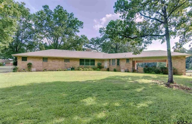 114 Mockingbird, Mount Pleasant, TX 75455 - ranch-style house with a front lawn and brick siding