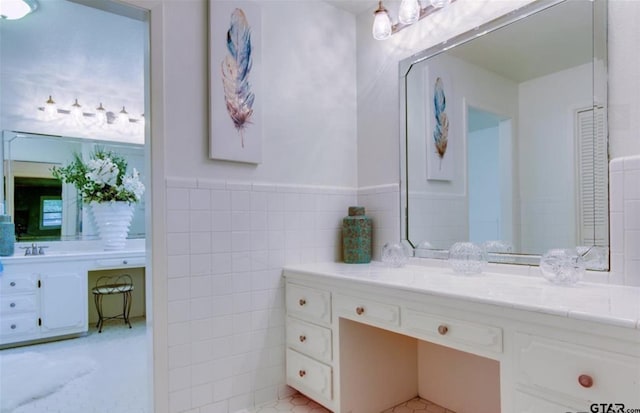 114 Mockingbird, Mount Pleasant, TX 75455 - bathroom featuring vanity and tile walls
