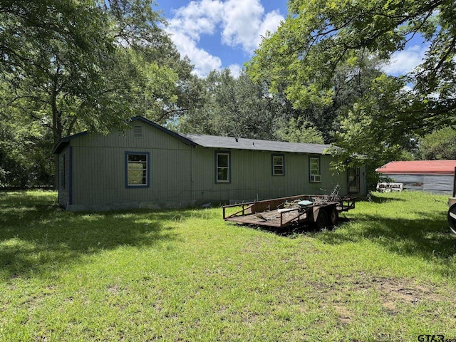 4066 County Rd 398, Tyler, TX 75707 - back of house with a yard