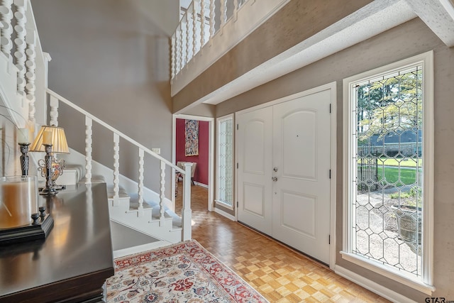 foyer with parquet flooring