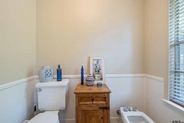 bathroom featuring a bidet and toilet