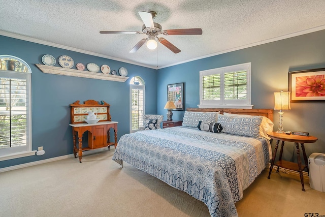 bedroom featuring carpet flooring, a textured ceiling, ornamental molding, and ceiling fan