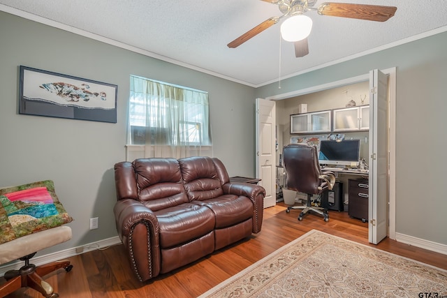 office featuring hardwood / wood-style flooring, ceiling fan, a textured ceiling, and crown molding