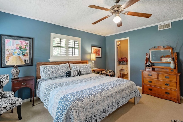 bedroom featuring ceiling fan, a textured ceiling, light carpet, and crown molding