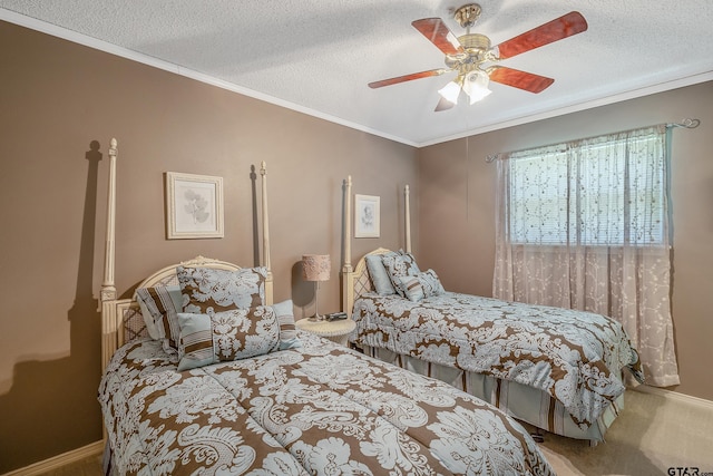 carpeted bedroom featuring a textured ceiling, ceiling fan, and crown molding