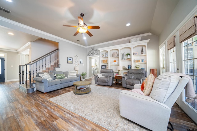 living room with ceiling fan, dark wood-type flooring, and ornamental molding