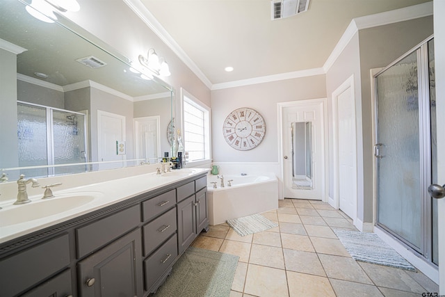 bathroom featuring tile patterned flooring, vanity, separate shower and tub, and crown molding